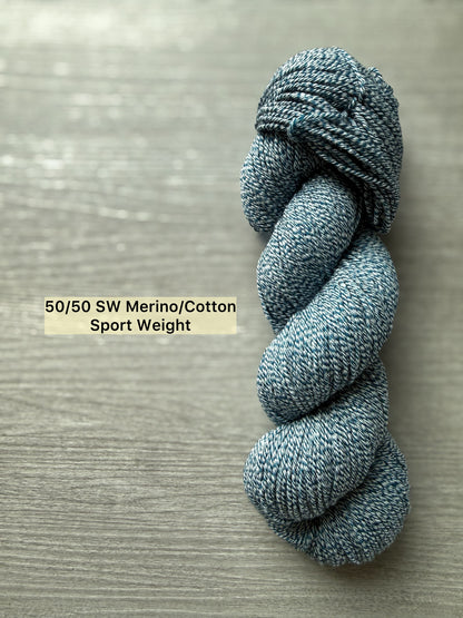 Ethically sourced 50/50 SW Merino/Cotton Sport Weight yarn in deep marine teal and white marl.