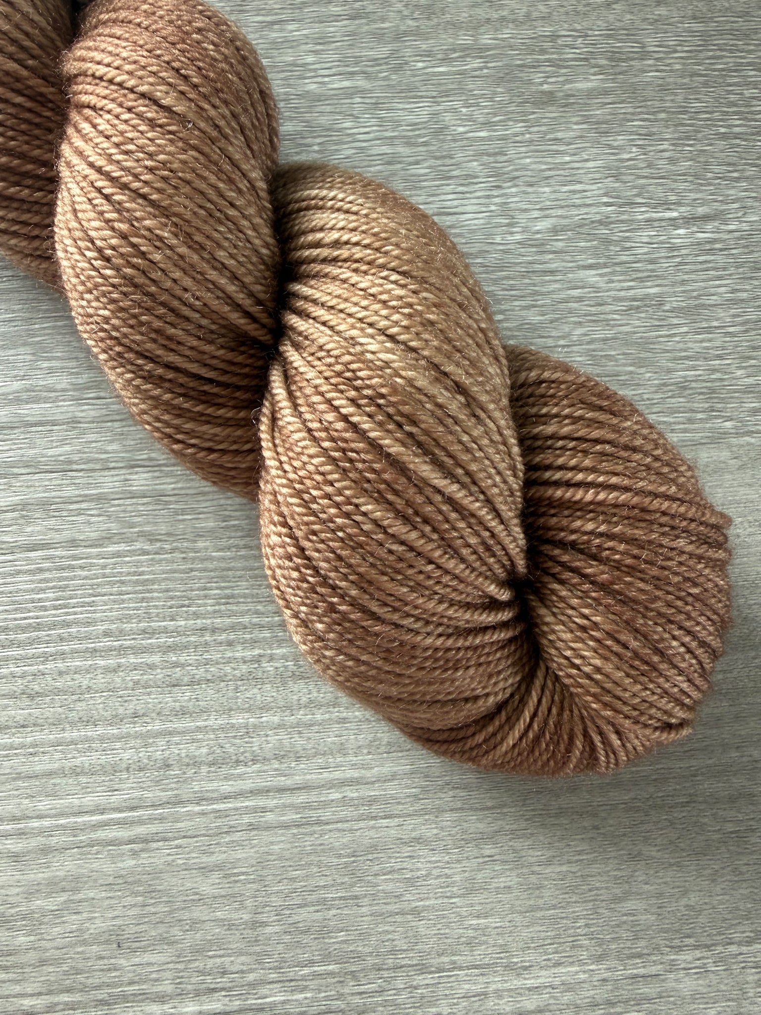 Lake House hand-dyed ethically sourced merino wool yarn in soft and medium browns.