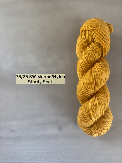 Hand-dyed "None Of Your Beeswax" golden yellow ethically sourced merino wool yarn skein.