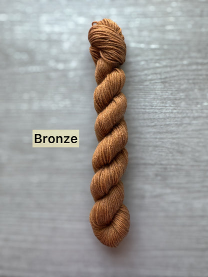 Bronze-colored yarn skein on a gray background with 'Bronze' label