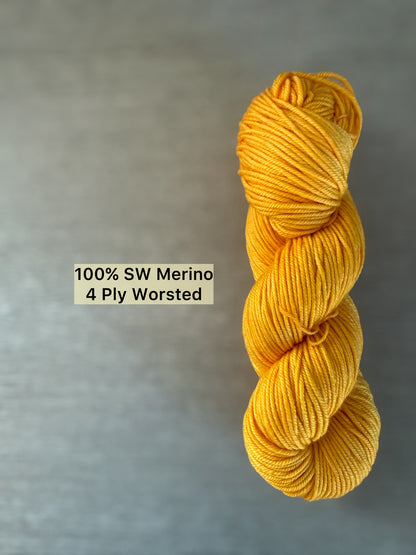 Bright golden yellow Soleil hand-dyed ethically sourced merino wool worsted yarn skein.