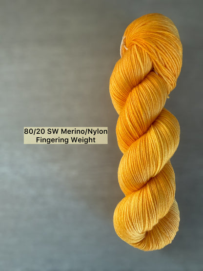 Bright golden yellow Soleil hand-dyed 80/20 SW Merino/Nylon fingering weight yarn skein.