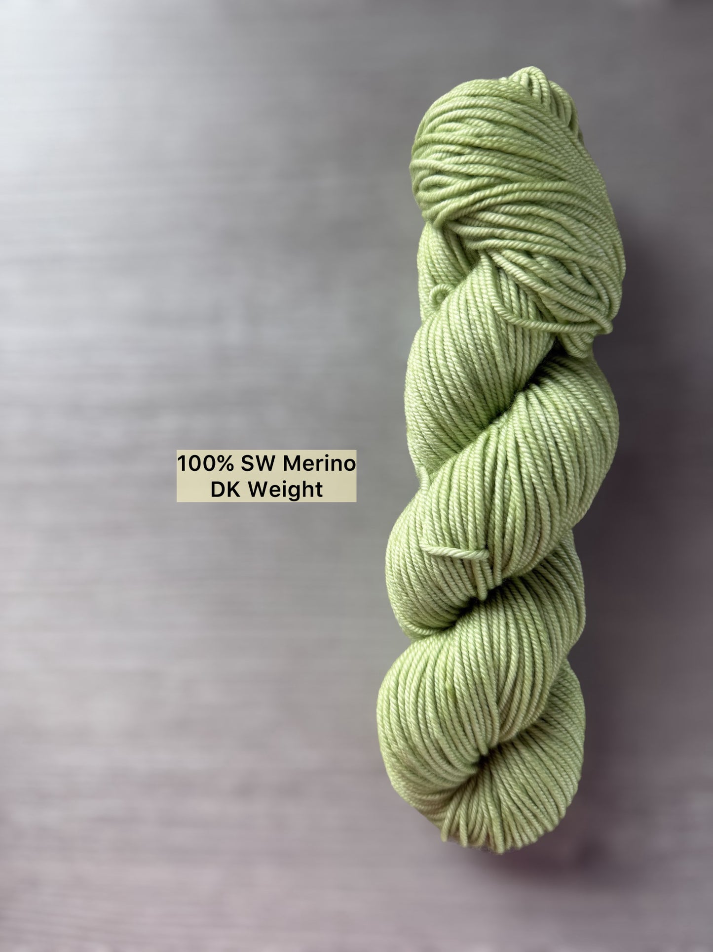 Vibrant lime green "Too Many Margaritas" hand-dyed 100% SW Merino DK weight yarn skein.