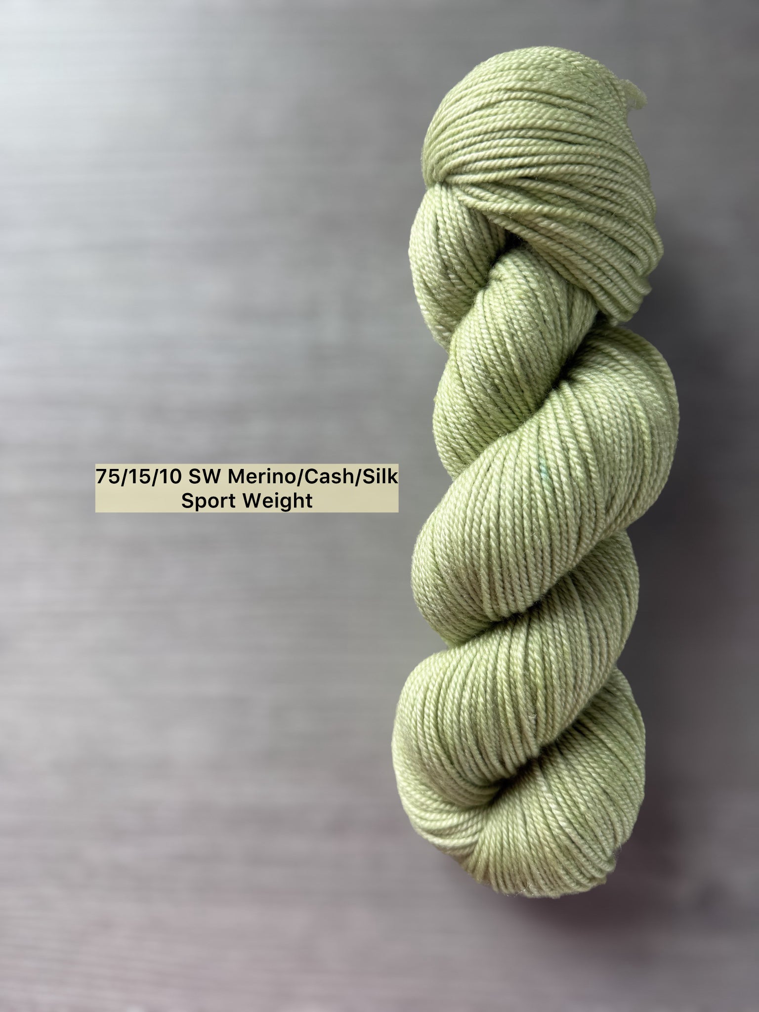 Vibrant lime green "Too Many Margaritas" hand-dyed ethically sourced merino wool yarn skein.