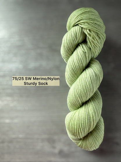 Vibrant lime green hand-dyed merino wool yarn, ethically sourced, in a twisted skein.